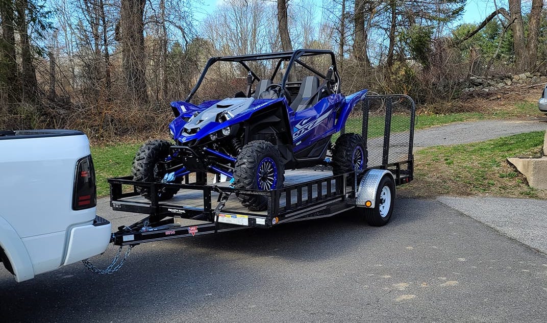 A Yamaha YXZ in a Flat bed trailer